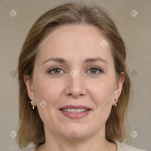 Joyful white adult female with medium  brown hair and grey eyes