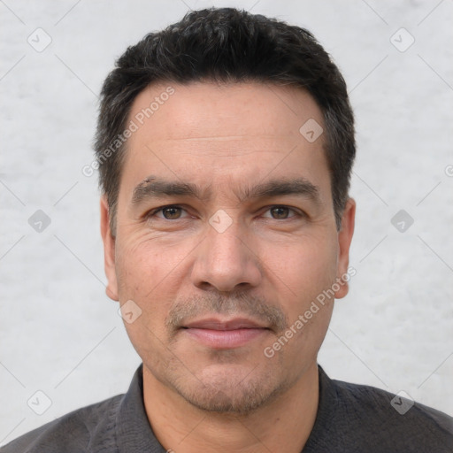 Joyful white adult male with short  black hair and brown eyes