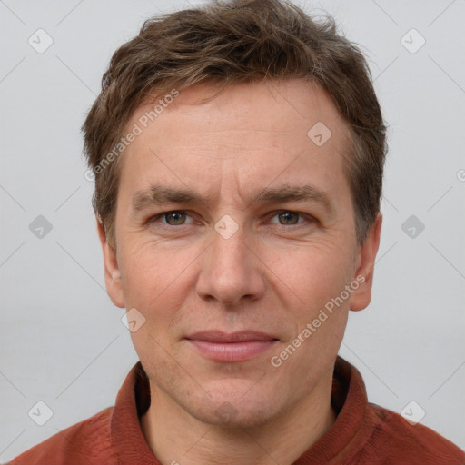 Joyful white adult male with short  brown hair and grey eyes