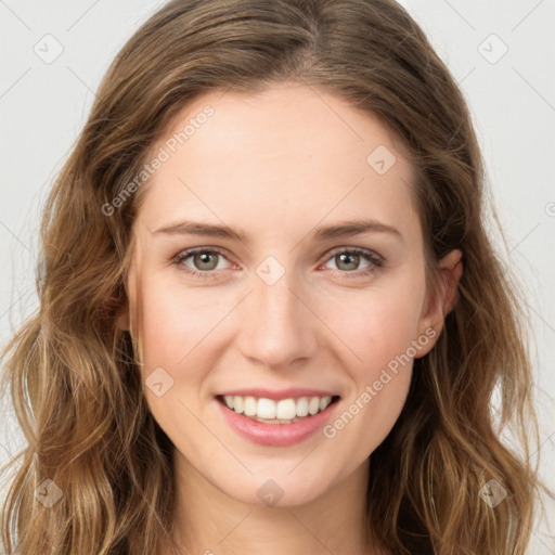 Joyful white young-adult female with long  brown hair and green eyes