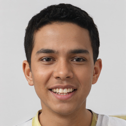 Joyful latino young-adult male with short  brown hair and brown eyes