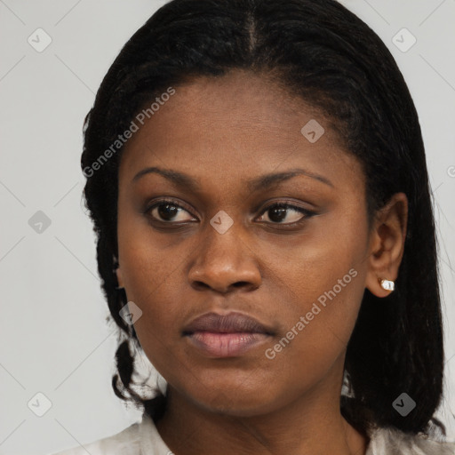 Joyful black young-adult female with medium  brown hair and brown eyes