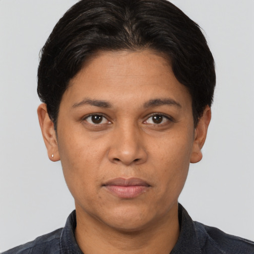 Joyful white adult female with short  brown hair and brown eyes