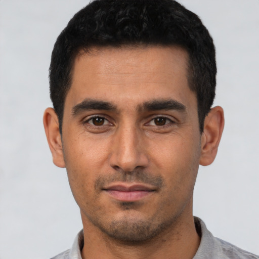 Neutral white young-adult male with short  black hair and brown eyes