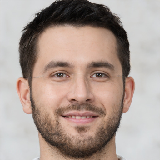 Joyful white young-adult male with short  brown hair and brown eyes