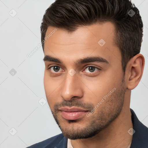 Neutral white young-adult male with short  brown hair and brown eyes