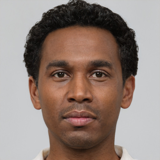 Neutral black young-adult male with short  black hair and brown eyes