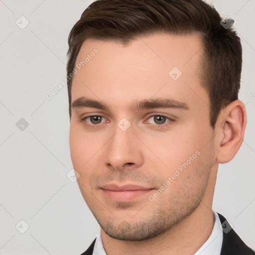 Neutral white young-adult male with short  brown hair and brown eyes