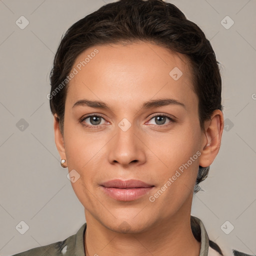 Joyful white young-adult female with short  brown hair and brown eyes