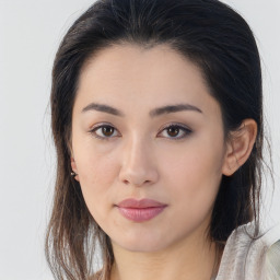 Joyful asian young-adult female with long  brown hair and brown eyes