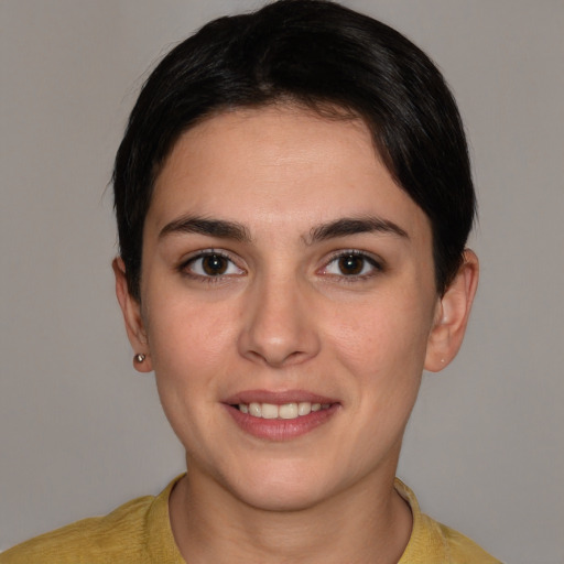 Joyful white young-adult female with short  brown hair and brown eyes