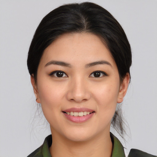 Joyful asian young-adult female with medium  brown hair and brown eyes