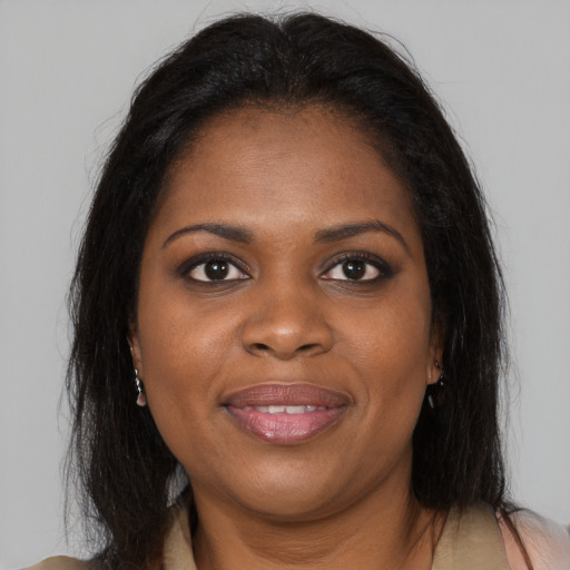 Joyful black young-adult female with medium  brown hair and brown eyes