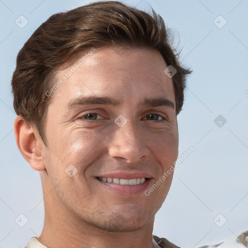 Joyful white adult male with short  brown hair and grey eyes