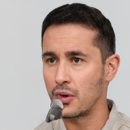 Neutral white young-adult male with short  black hair and brown eyes