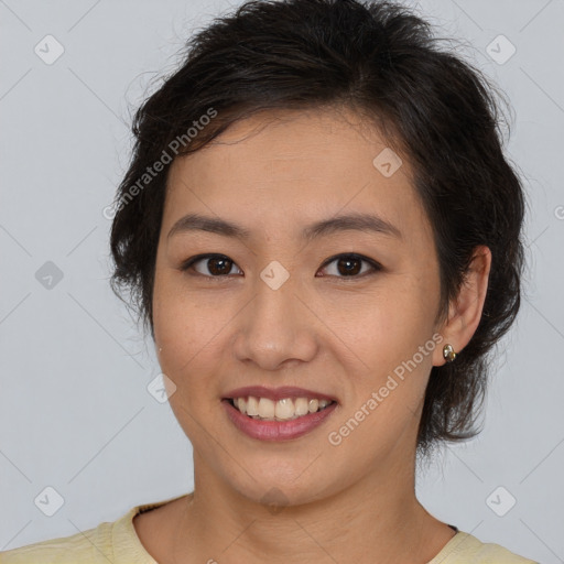 Joyful asian young-adult female with short  brown hair and brown eyes