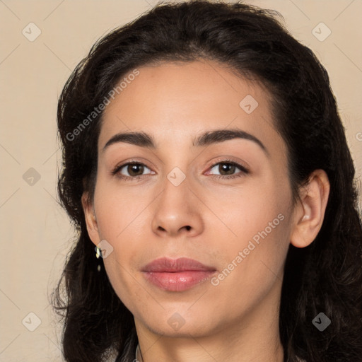 Joyful latino young-adult female with long  brown hair and brown eyes