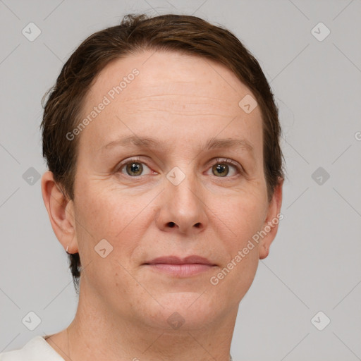 Joyful white adult female with short  brown hair and grey eyes