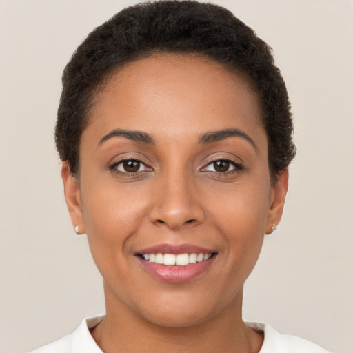 Joyful white young-adult female with short  brown hair and brown eyes