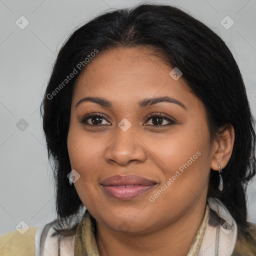 Joyful latino young-adult female with medium  brown hair and brown eyes
