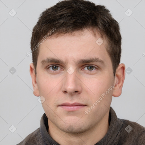 Neutral white young-adult male with short  brown hair and grey eyes