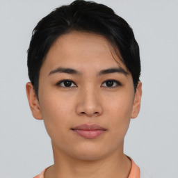 Joyful asian young-adult female with short  brown hair and brown eyes