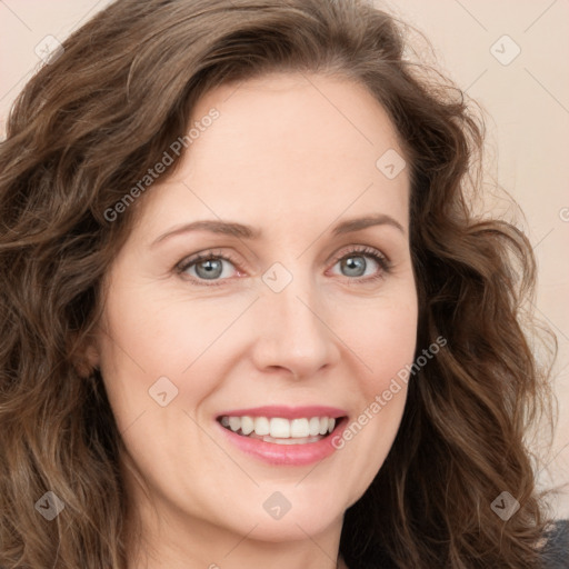 Joyful white young-adult female with long  brown hair and green eyes