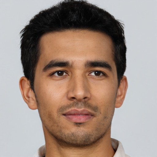 Neutral latino young-adult male with short  black hair and brown eyes