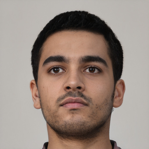 Neutral latino young-adult male with short  black hair and brown eyes