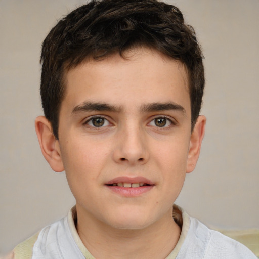 Joyful white child male with short  brown hair and brown eyes