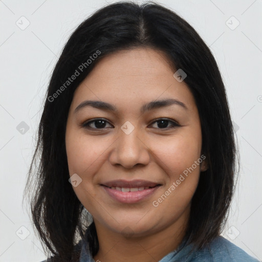 Joyful latino young-adult female with medium  brown hair and brown eyes