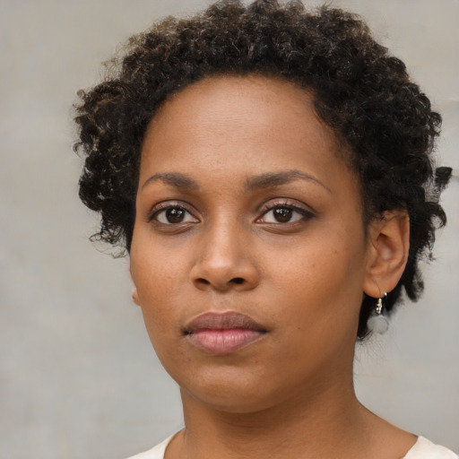 Neutral black young-adult female with short  brown hair and brown eyes