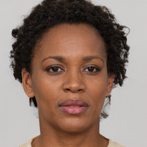 Neutral black adult female with short  brown hair and brown eyes