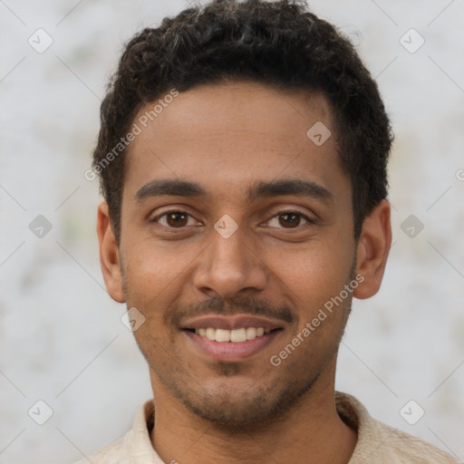 Joyful latino young-adult male with short  brown hair and brown eyes