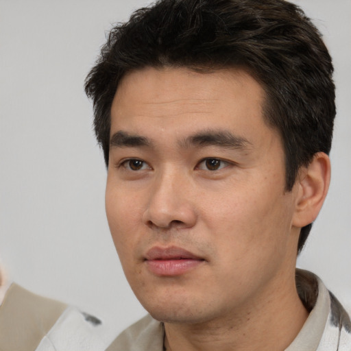 Neutral white young-adult male with short  black hair and brown eyes