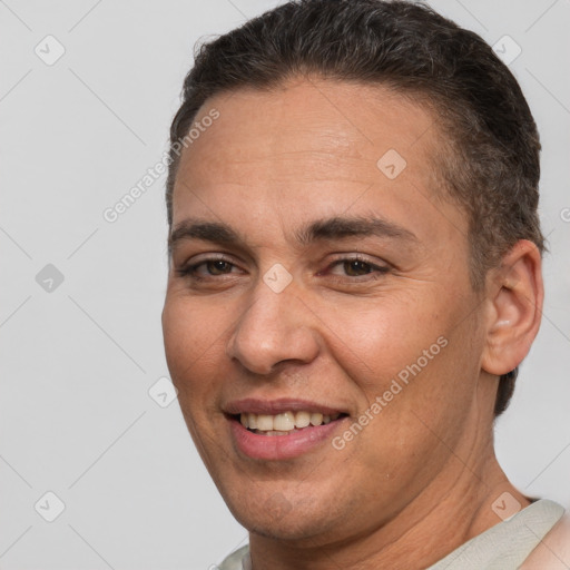 Joyful white adult male with short  brown hair and brown eyes