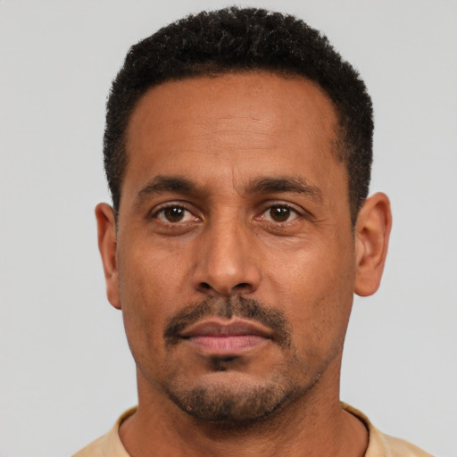 Neutral black adult male with short  black hair and brown eyes