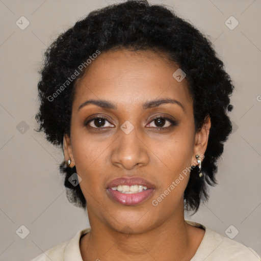 Joyful black young-adult female with short  black hair and brown eyes