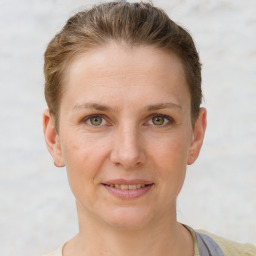 Joyful white adult female with short  brown hair and brown eyes