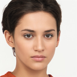 Neutral white young-adult female with short  brown hair and brown eyes