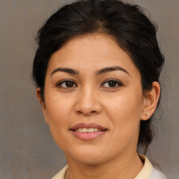 Joyful asian young-adult female with medium  brown hair and brown eyes