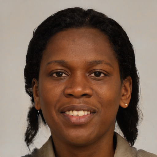 Joyful black young-adult female with medium  black hair and brown eyes