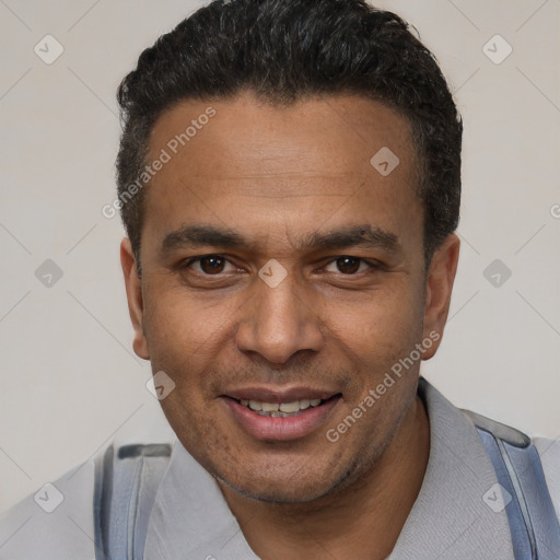 Joyful latino young-adult male with short  brown hair and brown eyes