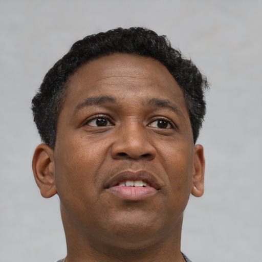 Neutral black young-adult male with short  brown hair and brown eyes