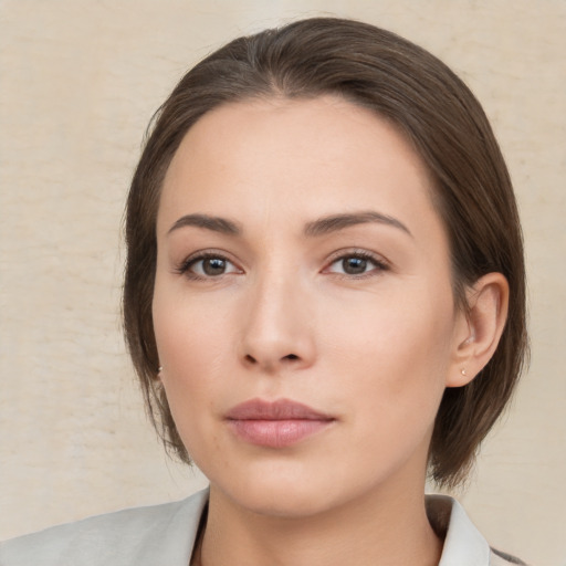 Neutral white young-adult female with medium  brown hair and brown eyes