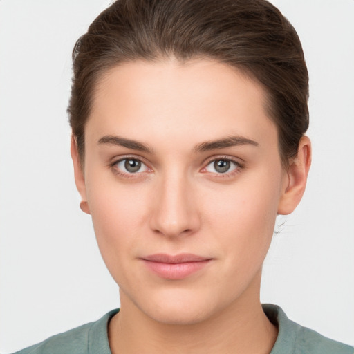 Neutral white young-adult female with short  brown hair and brown eyes