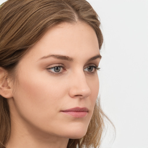 Neutral white young-adult female with long  brown hair and grey eyes