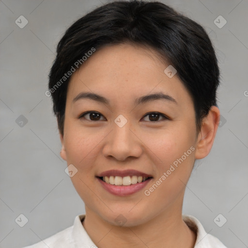 Joyful asian young-adult female with short  brown hair and brown eyes