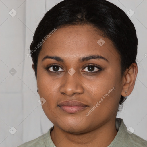 Joyful latino young-adult female with short  black hair and brown eyes