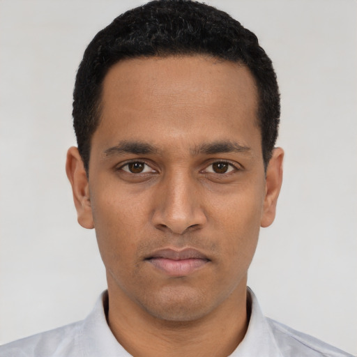 Neutral latino young-adult male with short  black hair and brown eyes